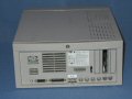 The rear of the unit.  Across the bottom are the standard assorments of display, SCSI, AAUI, serial and ADB ports.  There are also three NuBus slots. - q650-02.jpg