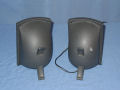The rear of the black speakers showing the tilt adjustment. - powered-speakers-ii-02.jpg