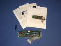 The box contains the card with connector cable, manuals, and a small apple branded wrench. - apple-ii-scsi-02.jpg
