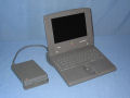 The PowerBook Duo in the Duo Minidock with a HDI-20 external floppy drive attached.  This is one of three ways (a full dock or the floppy adapter are the others) to use floppy disks with the Duo. - duo210-07.jpg