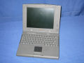 The PowerBook with the screen opened.  In contrast to the <a href="/apple/powerbook/duo/210/">Duo 210</a> this features a touchpad versus a trackball. - duo2300c-03.jpg