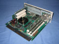 The logic board which is the same board as in the <a href="/apple/powermac/6360/">Power Mac 6360</a> except that the PCI riser features two slots due to more space available in the chassis. - pm6400-08.jpg