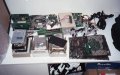 The Parts pile.  These are parts that I deemed (rightly?) worthwhile to save.  Old hard drives (IDE and MFM), floppy drives, memory, pentium motherboard, and various cables. - sorted3.jpg