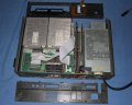 The plastic front and rear panels detatch from the metal chassis.  Removing the rear panel does not achieve much but removing the front facilitates changing the keyboard IR module and futher disassembly of the system. - ibm-jx-05.jpg