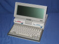 The system ready for use features an LCD screen, two 720KB 3.5" floppy drives and a keyboard. - pc-convertible-01.jpg